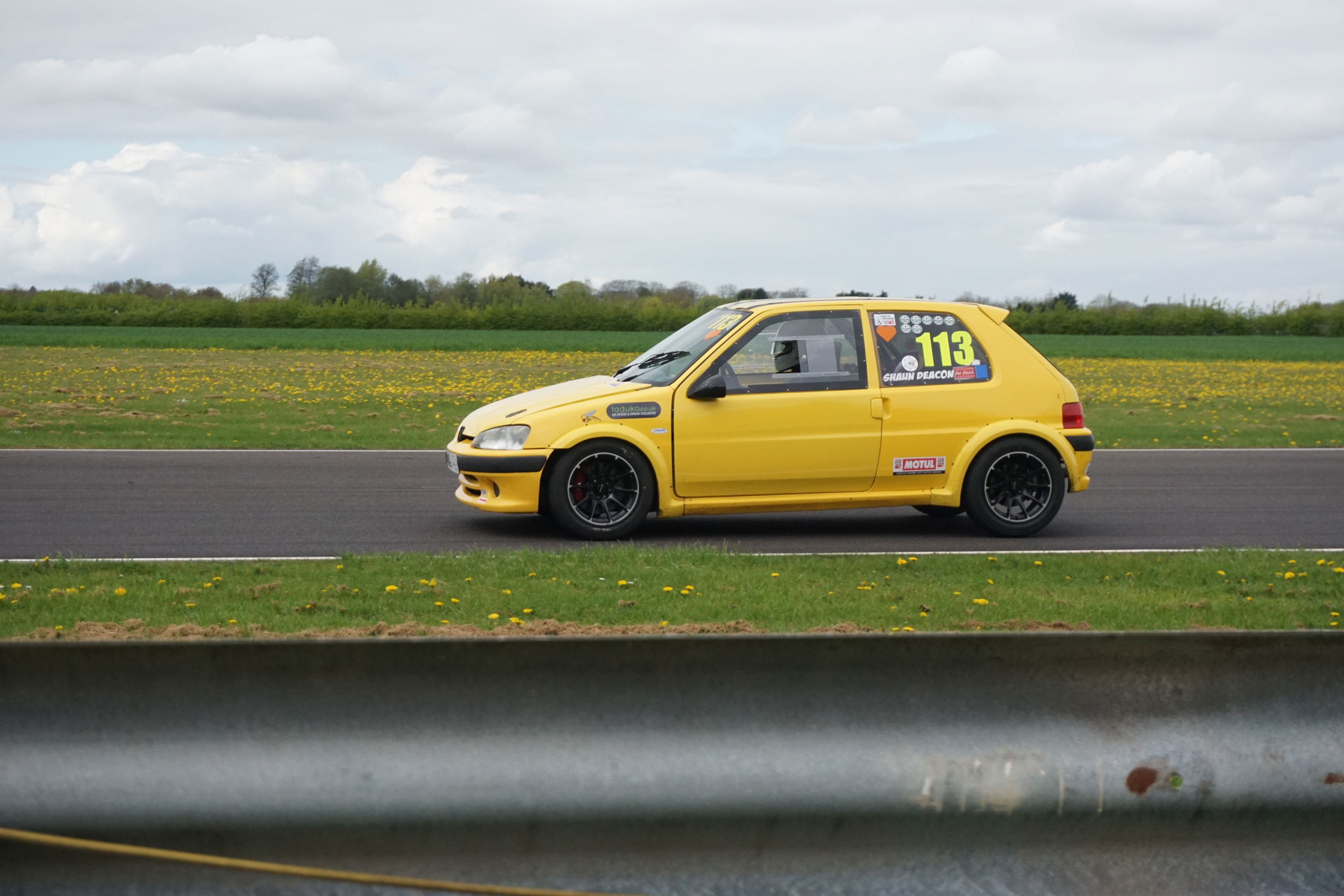 Shaun Deacon from ES racing in the car going round the race track